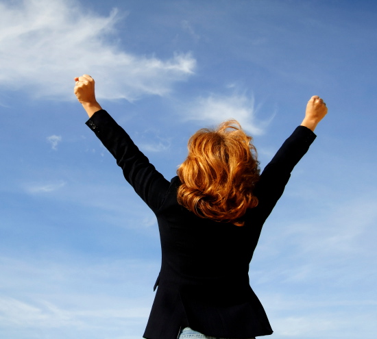 woman with arms up in the air